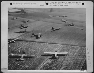 Consolidated > GLIDERS DOT THE GERMAN LANDSCAPE--Allied gliders dot the German landscape behind the German front lines on the Rhine. Parachute troops were dropped, 24 March 1945 in advance of the Rhine-crossing ground troops by 1500 transports and