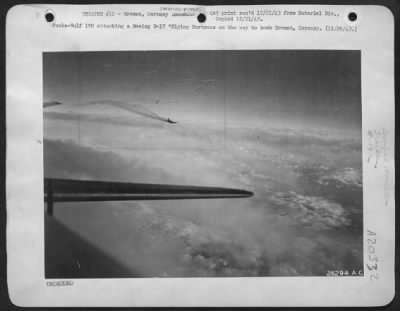 Consolidated > Focke-Wulf 190 attacking a Boeing B-17 Flying Fortress on the way to bomb Bremen, Germany.