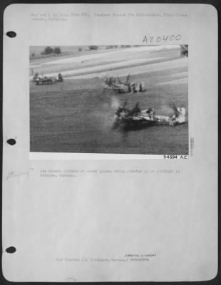 Consolidated > Gun camera picture of enemy planes being strafed at an airfield in Cologne, Germany.