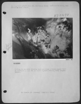 Consolidated > Filling the air with blinding smoke and flame a German supply train is destroyed by U.S. 8th Air Force fighters strafing enemy targets. GERMANY.