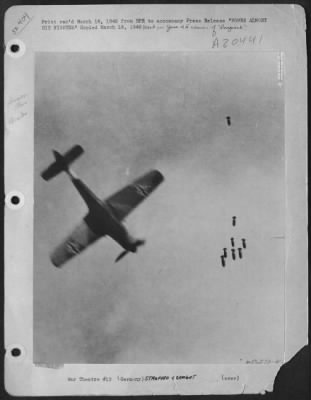 Consolidated > BOMBS ALMOST HIT FIGHTER--A surprise objective in the form of an FW-190 German single engine fighter looms beneath bombs dropped by a 9th Bombardment Division B-26 Marauder. It was a near miss for the bombs. This remarkable photograph, taken