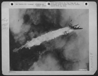 Consolidated > B-24 IN FLAMES-A B-24 Liberator of the U.S. Army 8th Air Force's 2nd Air Division goes down in flames during an attack on the railway marshalling yards at Munster, Germany. The port wing is breaking off as the blazing fuel tanks leave a trail of fire