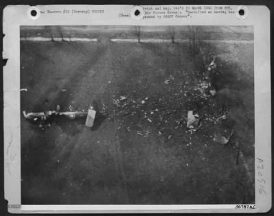 Consolidated > MUTE EVIDENCE--Pictured is one of the 1500 transports and gliders which landed troops of the 1st Allied Airborne army behind the German lines in the face of Gen. Montgomery's Rhine-crossing ground forces. This RAF glider crashed into trees lining its