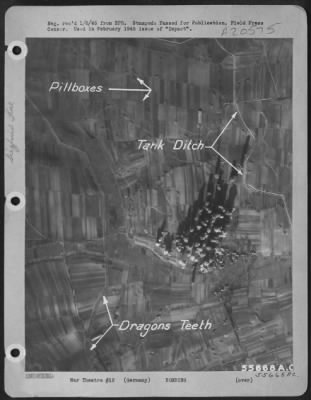 Consolidated > Bomb bursts from Martin B-26 Marauders of the First Tactical Air Force slash a path for the 7th Army through the Siegfried Line defenses northeast of Wissembourg in the Otterbach area. As seen from the air easily picked out in the Nazi defense line