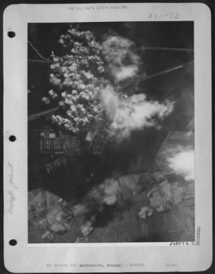 Consolidated > White buds of destruction-Like white budding flower blossoms, the bomb bursts in a compact cluster at the height of the attack on the Junkers aircraft engine plant at Arnimswalde, a few miles east of Stettin, during the April 11th 1944 assault by