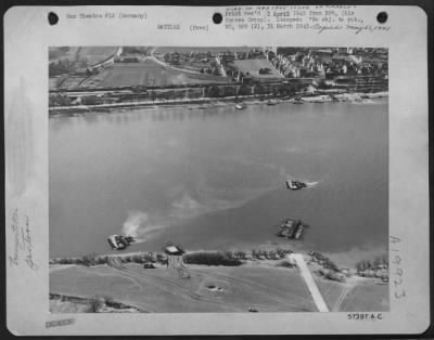 Consolidated > Germany - Protected By A Cover Of Figher-Bombers Provided By Major General O.P. Weyland'S Xix Tactical Air Command, Us 3Rd Army Troops Established A Bridgehead On The East Side (Foreground) Of The Rhine.  Tanks Are Being Ferried On Pontoon Rafts.  One Of