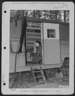 Consolidated > T/4 Clyde Lyman Of Kansas City, Mo., Examines The First Dial Phone Switchboard To Be Used In The Field By Us Army Forces.  The Switchboard, Housed In A Mobile Communications Van, Is With The 9Th Af Installation In Germany.