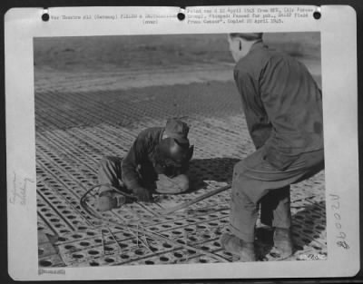 Consolidated > Aviation Engineer Technicians Of The Ix Engineer Command Weld Overlapping Sections Of Steel Planking On The Runway Of An Airstrip In Germany.  The Field, One Of The First Allied Strips In The Reich, Will Be Used By 9Th Af Fighter Bombers.  Sgt. A.E. Selle