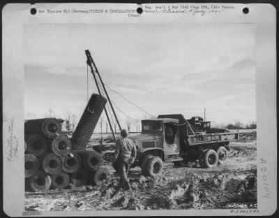 Consolidated > Aviation Engineers Of The 9Th Engineer Command Lifting Steel Matting For An Airstrip In Germany.