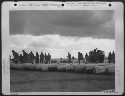 Consolidated > Aviation Engineers Laying Steel Planks On A Captured German Base.