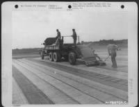 Men Of The 834Th Engineer Aviation Battalion Construct A Landing Strip At Buchschwabach, Germany, With 'Hessian Mat' Used For Surfacing.  The Mat, A Tar-Paper-Like Composition, Is Laid By Trucks Loaded With 200-Foot Rolls.   A 50% Overlap Is Maintained An - Page 3
