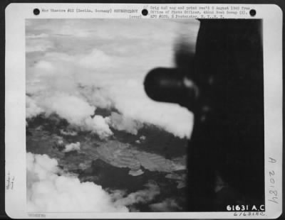 Thumbnail for Consolidated > Boeing B-17 "Flying Fortress" Of The 452Nd Bomb Group While Flying Enroute To Target At Berlin, Germany, Encounter Momentary Breaks In The Cloud Banks, Such As Shown In This Photogrpah.  Taken 22 March 1944.