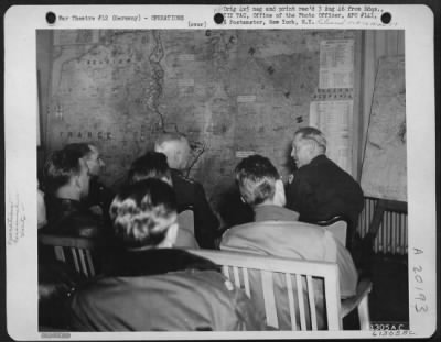 Consolidated > General Patton, Commanding General Of The 3Rd Us Army Attends A Xix Tactical Air Command Air Briefing.  Officers In The Front Row Are: (L To R) Brig. Gen. Homer L. Sanders, Commanding General, 100Th Fighter Wing; General Patton; Major General O.P. Weyland