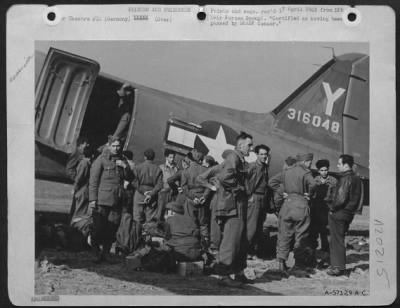 Consolidated > Former Prisoners Of War Flown From Front -- American And British Prisoners Of War Freed By Swift Allied Advances Are Being Flown Back From The Front In Douglas C-47 Cargo Planes Of The 9Th Troop Carrier Command.  A Group Of Freed British Troops Cross Exam