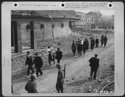 Consolidated > German Civilians Remove The Bodies Of Slave Workers From The Labor Camp Near Nordhausen, Germany As U.S. Soliders Supervise The Grisly Work.  Hundreds Of Workers Were Systematically Starved To Death By Their German Masters.  Photograph By A 9Th A.F. Camer