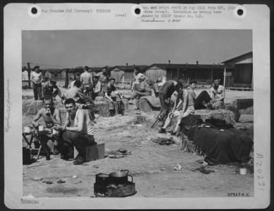 Consolidated > Straw Is A Luxury To These Allied Prisoners In A German Prison Camp.  Along With Tables To Eat On, Another Sign Of Freedom Was Straw For Mattresses -- A Luxury After Having Slept On Gravel Floors. Red Cross Packages, Despite Erratic Delivery By German Tra