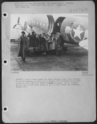 Consolidated > Germany -- It'S A Happy Moment For These Russians, Once Slave Laborers For Brutal Germans, As They Board A Douglas C-47 Transport To Be Flown To Russia From A 9Th Af Service Command Airstrip.  As His Parting Gesture Man On Left Faces Camera To Spit On Onc