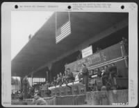 Glen Miller And His Band Strike Up One Of Their Favorite Tunes During A Performance For Men Of The 834Th Engineer Aviation Battalion Presented In The Sports Stadium At Nurnberg [Sic; Prob. Nuremberg], Germany.  {This Image Is Not Of Glenn Miller} - Page 1