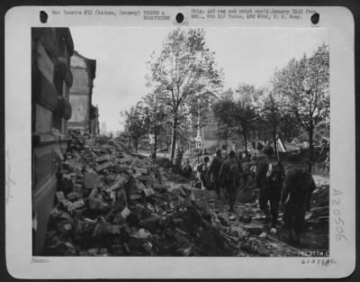 Consolidated > Following A Preliminary Softening Up By Artillery Tank-Destroyers And 9Th Af Dive Bombers Yank Infantrymen Are Shown Advancing Into The City Of Aachen, Germany.