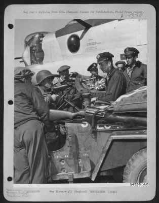 Consolidated > ENGLAND-8th AF men are given the opportunity of comparing notes with the ground forces in the combat zone. Ground force men trade souvenirs for flying clothes. A Luger pistol (item most in demand) will get a flying jacket and boots. Tank corp