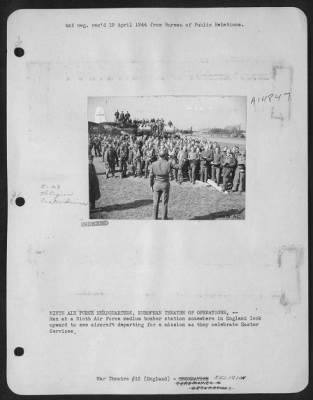 Thumbnail for Consolidated > NINTH AIR force HEADQUARTERS, EUROPEAN THEATRE OF OPERATIONS,--Men at a Ninth Air force medium bomber station somewhere in England look upward to see aircraft departing for a mission as they celebrate Easter Services.