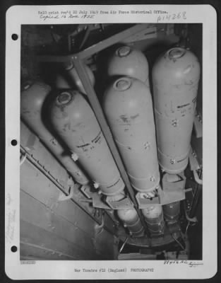 Consolidated > England - The Bomb Bay, Filled With Flash Bombs Just Before The Take-Off For A Night Reconnaissance Mission Over Breteuil, France, By Lt. Colonel Leon Gray'S U.S. 8Th Air Force Reconnaissance Group.  The Fuses Are Specially Set So That They Will Explode I