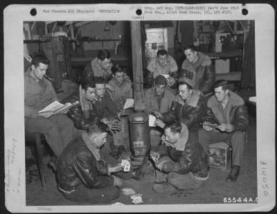Consolidated > Men Assigned To The Motor Pool Play Cards And Read In The Barracks During Off-Duty Hours.  401St Bomb Group, England, 25 March 1945.