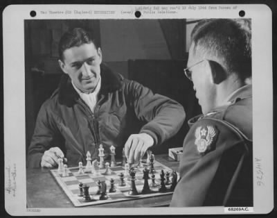 Consolidated > Lt. Colonel Francis S. Gabreski And 1St Lt. Oscar E. Collins, A Special Service Officer Of The 9Th Air Force And Former Basketball Coach Of Colonel Gabreski, Engage In A Friendly Game Of Chess And Talk Over Old Times.  England, 4 July 1944.