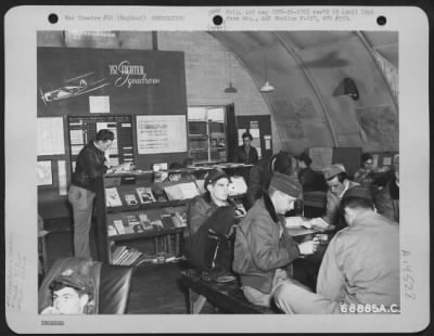 Consolidated > In The Briefing Room Of The 352Nd Fighter Squadron, 353Rd Fighter Group, Men Enjoy Reading Various Magazines And Books.  Station F-157, England, January 1944.