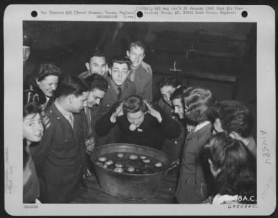 Consolidated > Men Of The 70Th Service Group Based At Great Dunmow, Essex, England, Duck For Apples At A Halloween Party Sponsored By The Aero Red Cross Club On 29 October 1943.