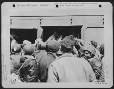 Thumbnail for Consolidated > Gis Of The 453Rd Bomb Group Crowd Around A Red Cross Clubmobile Where They Are Served Coffee And Doughnuts By A Pretty Red Cross Girl At A Base In England.