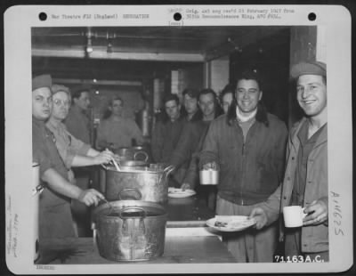 Thumbnail for Consolidated > Gis Of The 379Th Bomb Group Pass Thru The Chow Line At An 8Th Air Force Base In England On 12 March 1945.