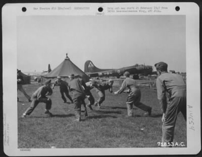Consolidated > During Off Duty Hours Members Of The 379Th Bomb Group Participate In A Spirited Game Of Football At An 8Th Air Force Base In England.  20 April 1944.