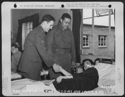 Consolidated > Joe Louis And Billy Conn (Right To Left) Cheer A Hospitalized Member Of The 2Nd Base Air Depot In Lancashire, England.  6 July 1944.