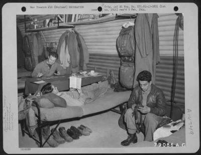 Consolidated > Relaxing In The Quarters Are These Members Of A Liberator Crew Named "Night Raider".  Playing Solitaire Is S/Sgt. Stephen L. Hegedua, Milwaukee, Wisc. Tail Gunner; S/Sgt. James V. Roberts, Waverly, Iowa., Turret Gunner Is Reading And S/Sgt. Richard L. Gue