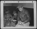 S/Sgt. Maynard H. Smith Of Caro, Mich., A Member Of The 423Rd Bomb Squadron, 306Th Bomb Group And A Congressional Medal Of Honor Recipient, Tries His Skill At Peeling Pototes At His Base In England.  Sgt. Smith Received The Award For Extinguishing The Fir - Page 1