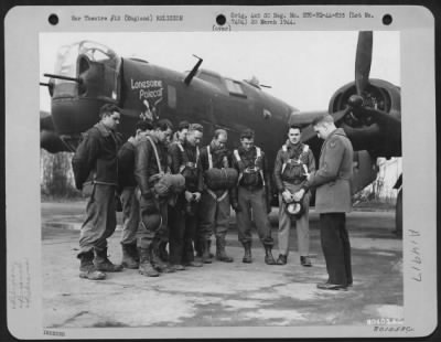 Consolidated > Capt. James A. Burrsi, Chaplain, Leads Ground And Flight Crews Of The Consolidated B-24 'The Lonesome Polecat' In Prayer, Before They Take Off On A Mission Over Europe, At An Airbase In Hardwick, England.  31 January 1944.