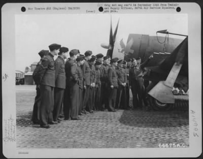 Consolidated > Lt. Penix Points Out Armament On A Republic P-47 To Members Of The British Air Training Corps Who Are Visiting The 1St Combat Crew Replacement Center In England.  23 April 1944.