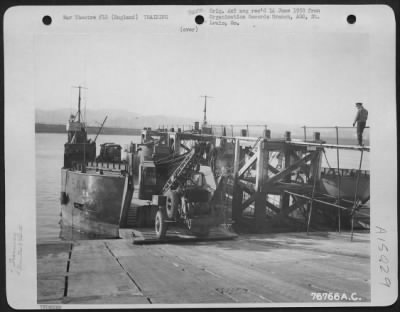 Consolidated > Members Of The 834Th Engineer Aviation Battalion Load Equipment Aboard A Landing Craft During Amphibious Training At Torquay, England.