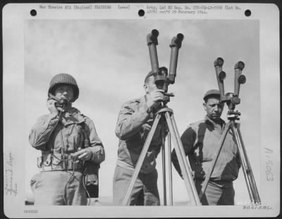 Consolidated > The Battalion Command Scope In Action During Target Practice At Salibury Place, Wilts, England, Is Operated By, Left To Right: T/5 Robert Seitz, Newville, Penn (On Phone); Capt. James F. Mcgrath, Dubois, Penn., And Capt. Harold L. Miller, Lewisburg, Penn.