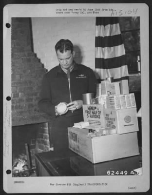 Consolidated > Officer Of The 493Rd Bomb Group Checking Food Rations Prior To 'Food Mission' Flight.  England, 7 April 1945.