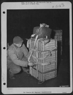 Consolidated > Qm Troops Of The 490Th Qm Depot And The 101St Airborne Division Try Out The British Pannier Basket For Delivering Supplies To Troops On The Ground.  Here, An Airman Attaches The Harness And Parachute To A Loaded Basket Before Placing It In The Plane.  Ber