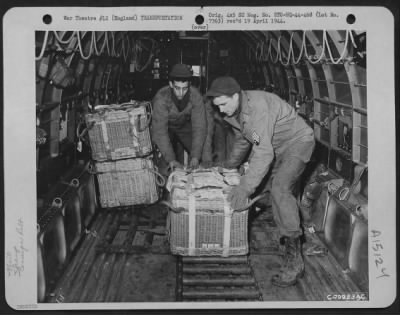 Consolidated > Qm Troops Of The 490Th Qm Depot And The 101St Airborne Division Try Out The British Pannier Basket For Delivering Supplies To Troops On The Ground.  Here, Men Push A Basket Over The Roller Conveyor Inside The Plane Toward The Door Where It Will Start Its