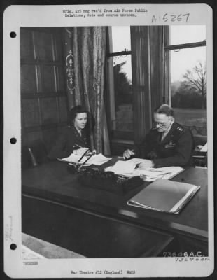 Consolidated > Capt. Sarah Bagby Of St. Louis, Mo., Confidential Secretary To Lt. General Carl A. Spaatz, Commanding General Of U.S. Strategic Air Force In Europe, Takes Dictation From General Spaatz At An Airbase Somewhere In England.