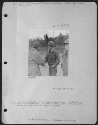 General > Major General Leland S. Hobbs, Left, Commanding General, Awards The 5Th Oak Leaf Cluster To The Air Medal To 1St Lt. Harold W. Hale, Right, Of Hamburg, N.Y.  Lt. Hale Is The Pilot Of An Artillery Liaison Plane.