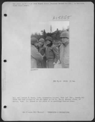 General > Major General Leland S. Hobbs, Left, Commanding General 30Th Inf. Div., Awards The 3Rd Oak Leaf Cluster To The Air Medal To 1St Lt. Bob M. Spicer, Right, Of Renton, Wash.  Lt. Spicer Is The Pilot Of An Artillery Liaison Plane.