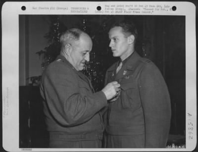 General > Major General Ralph Royce pins the Air Medal on his aide, Capt. John Lee Frisbee, 31 Cherry Street, Oneonto, N.Y. Capt. Frisbee, a Republic P-47 Thunderbolt pilot, received the award in recognition of meritorious achievement