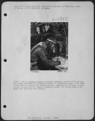 General > EUROPE-1st Lt. Grant H. Benson, Stambaugh, Michigan, veteran of 28 missions over enemy territory in the European theatre of operations, shown at his table in the nose of a Boeing B-17 Flying ofrtress, computing and charting a course across