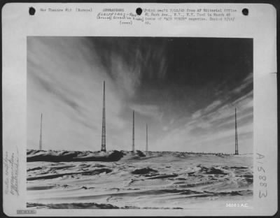 Thumbnail for Radio > Radio range transmitter towers rise above the windswept snow blanket which covers this station on the North Atlantic air route to the European theatre.