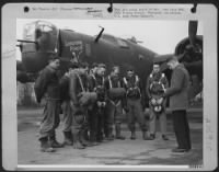 Capt. James A. Burriss, Chaplain at an Air force station somewhere in the ETO, leads ground and flight crews of the "Lonesome Polecat" in prayer before they take off on a mission over Hitler-held Europe. - Page 1
